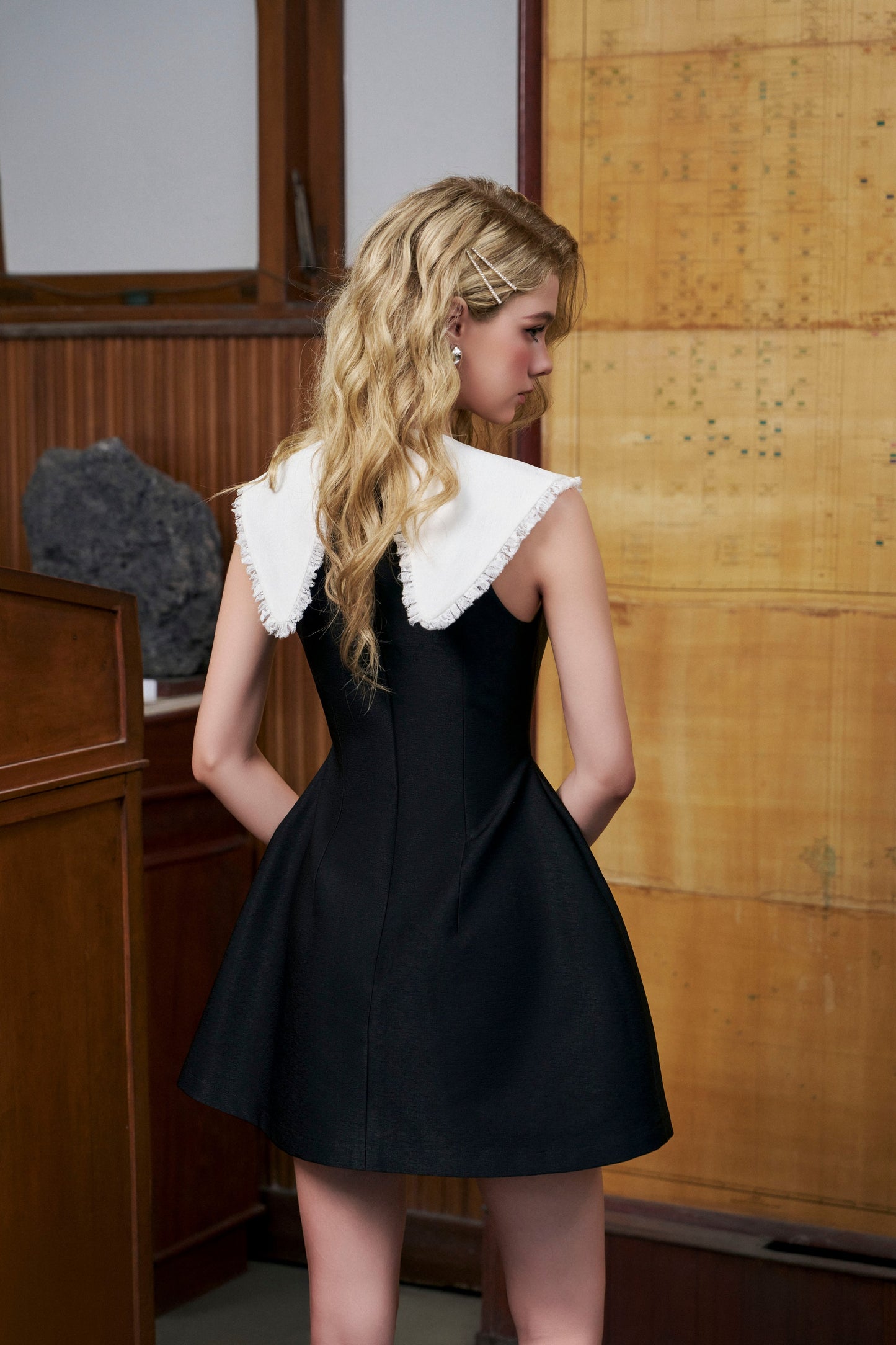 Black bell-shaped dress with white collar