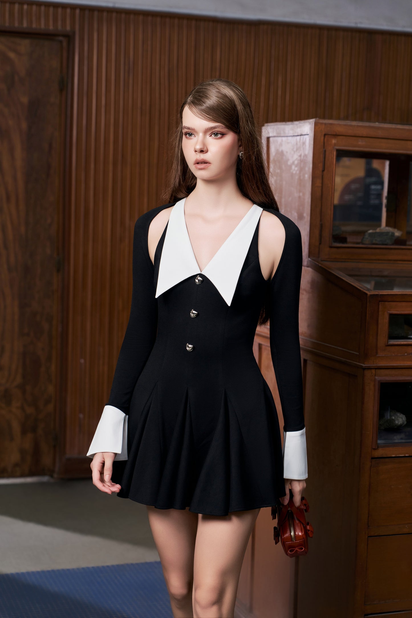 Black dress with white collar and leaf shape