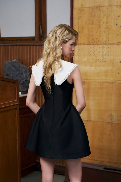 Black bell-shaped dress with white collar